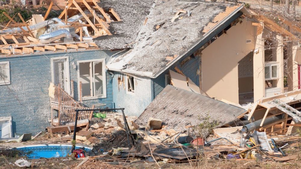 Photo of home damaged in a storm that owner's will be filing homeowner's insurance and FEMA claims.