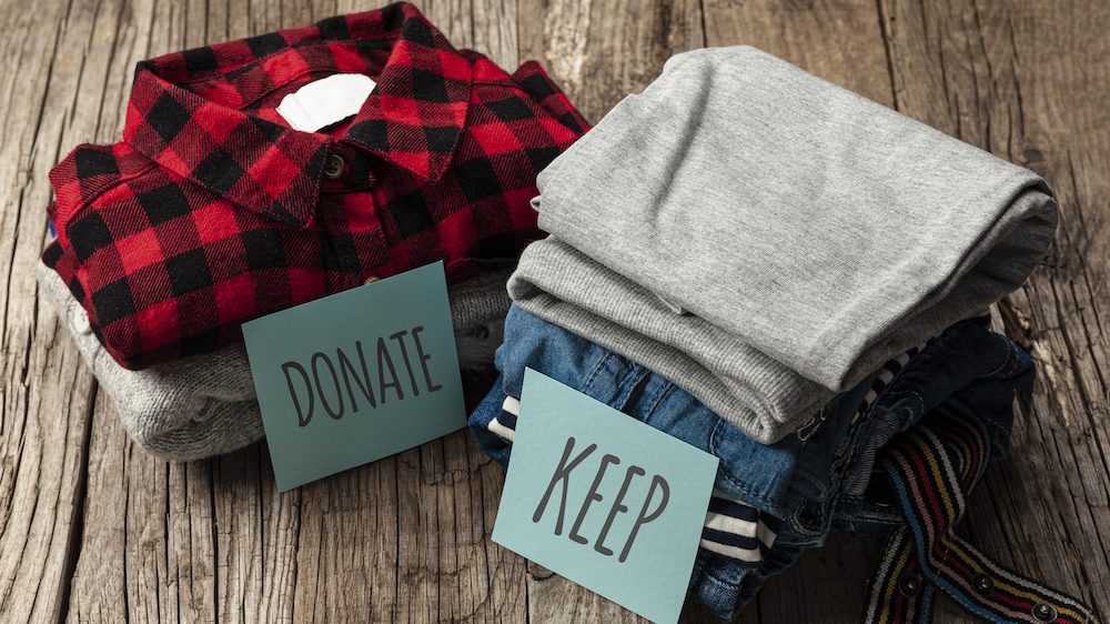 Stack of old clothes to discard or keep for January To-Dos list.