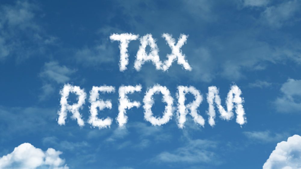 Tax law reform cloud word on top of a blue sky.