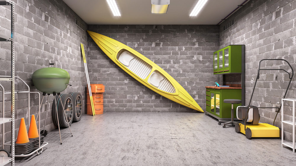 Interior of garage with sports gear organized against the walls.