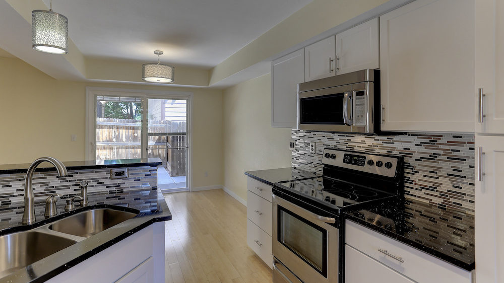 Empty kitchen of a vacant home that is for sale.
