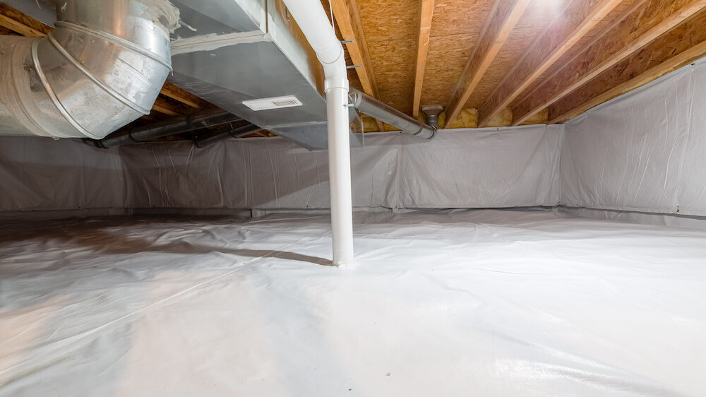 A home crawl space fully encapsulated with a vapor barrier.